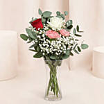 Rosy Carnation Delight in Curved Vase