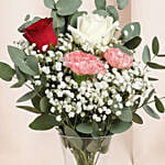 Rosy Carnation Delight in Curved Vase