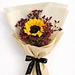 Sunflower surrounded by burgundy statice bouquet