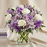 White And Purple Floral Bunch In Glass Vase