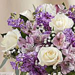 White And Purple Floral Bunch In Glass Vase