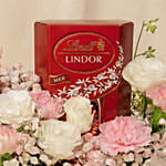 Charming Pink Basket with Flowers, Lindt Chocolates & Candle
