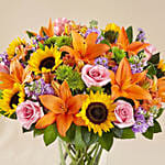 Vibrant Bunch of Flowers In Glass Vase