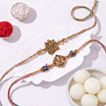 Divine Duo Radha Krishna and Ganesha Rakhi Set with Rasgulla