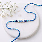 Minamalistic Navy Evil Eye Rakhi with Motichoor Ladoo