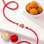 Crimson Pearl Floral Rakhi with Motichoor Ladoos